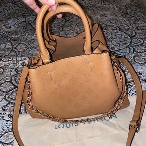 Tan leather bag with handles and cross body